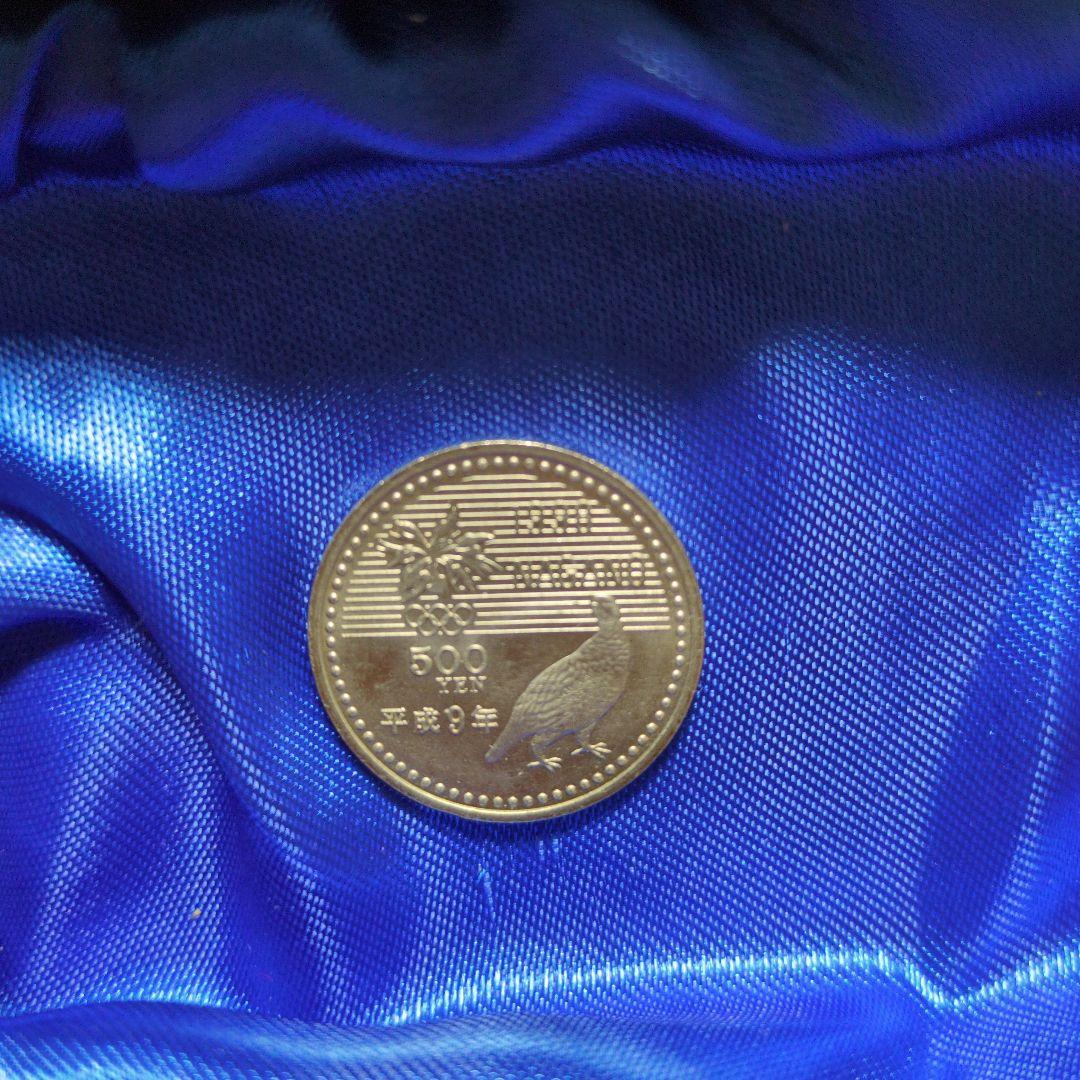 1998年長野オリンピック記念硬貨✖10枚、1975年沖縄海洋博記念硬貨✖4枚