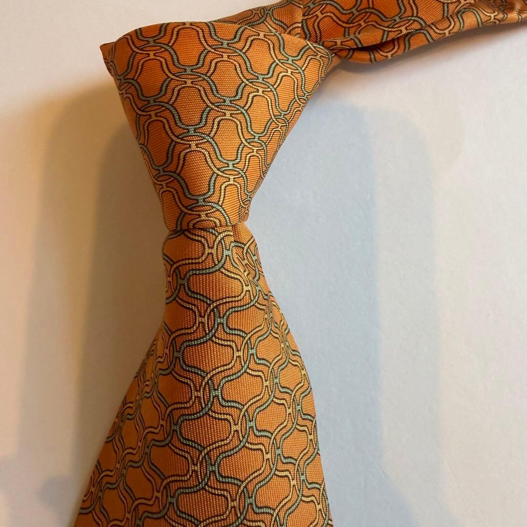 美品　エルメス　HERMESオレンジ 幾何学模様 H柄　高級ブランドネクタイ