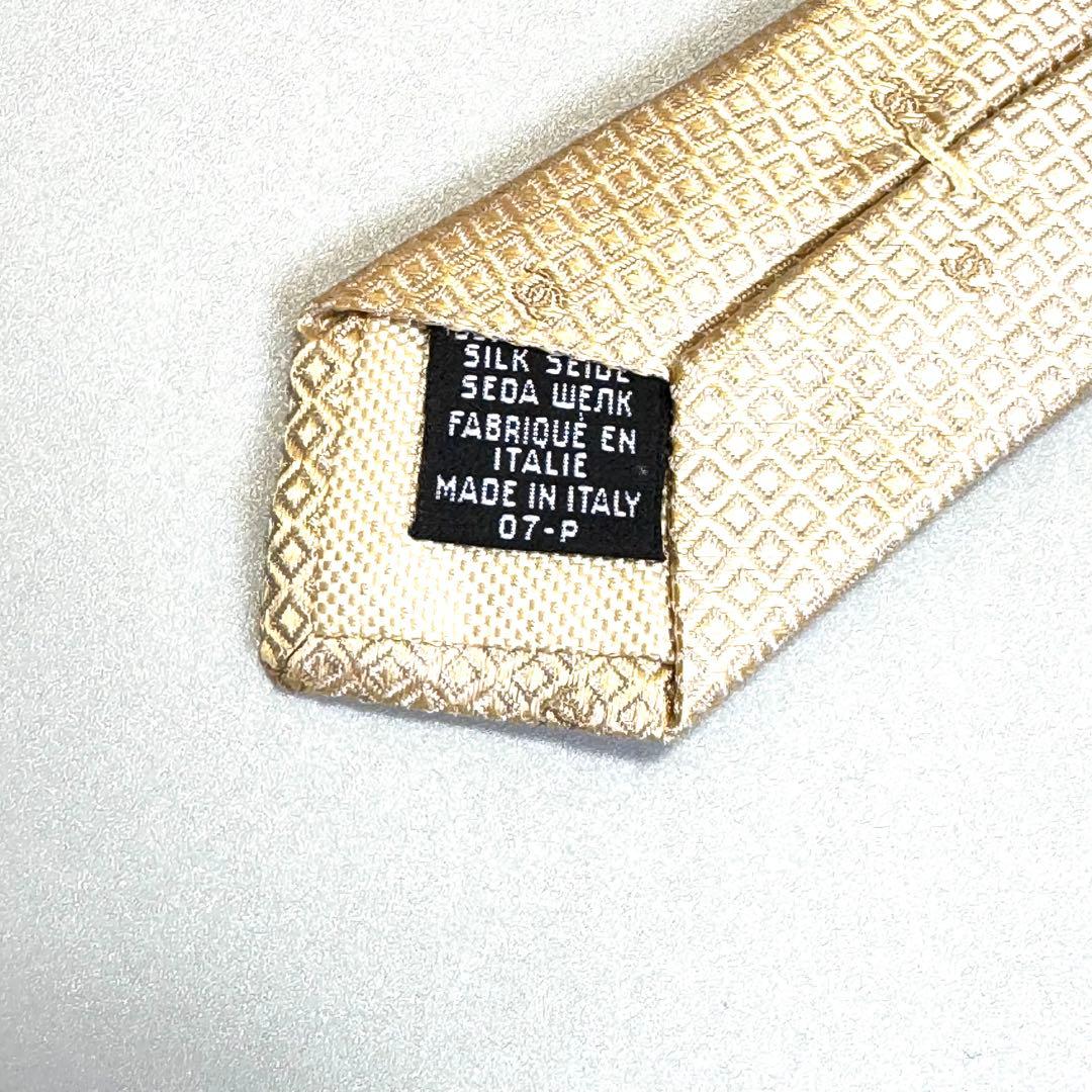 CHANEL ネクタイ シルク100% ココマーク総柄 ゴールド系　チェーン付