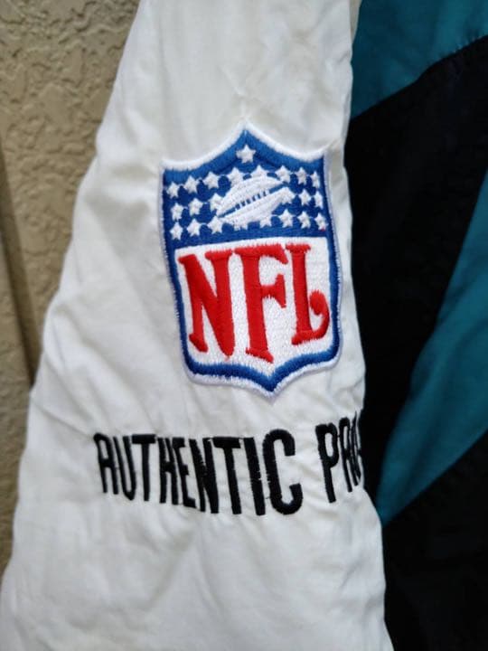 95年製新品未使用!NFL·ジャガーズフード付きジャケット·LAロゴ製!　Ｌ