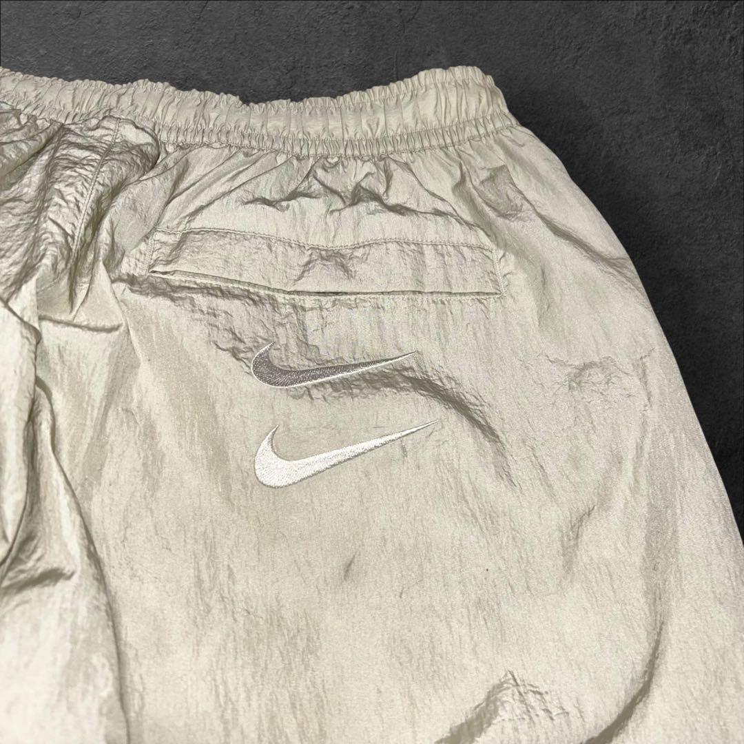 NIKE ダブルスウッシュ刺繍ロゴ テックウィンドパンツ ナイロンパンツ