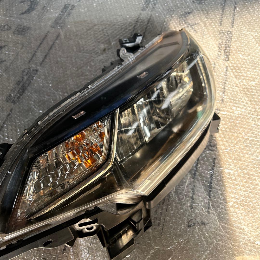 フィット　ヘッドライト　左　STANLEY W3674 ジャンク品