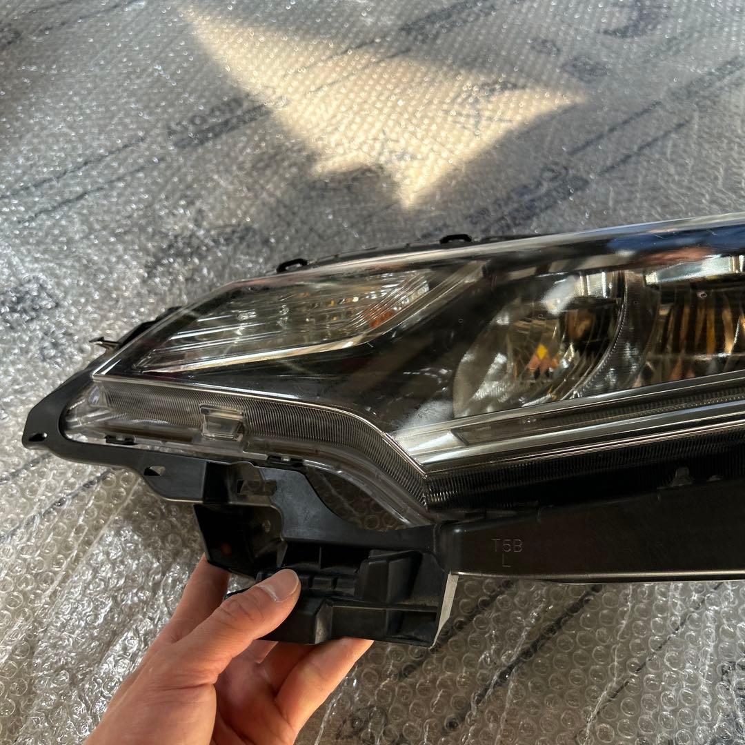 フィット　ヘッドライト　左　STANLEY W3674 ジャンク品
