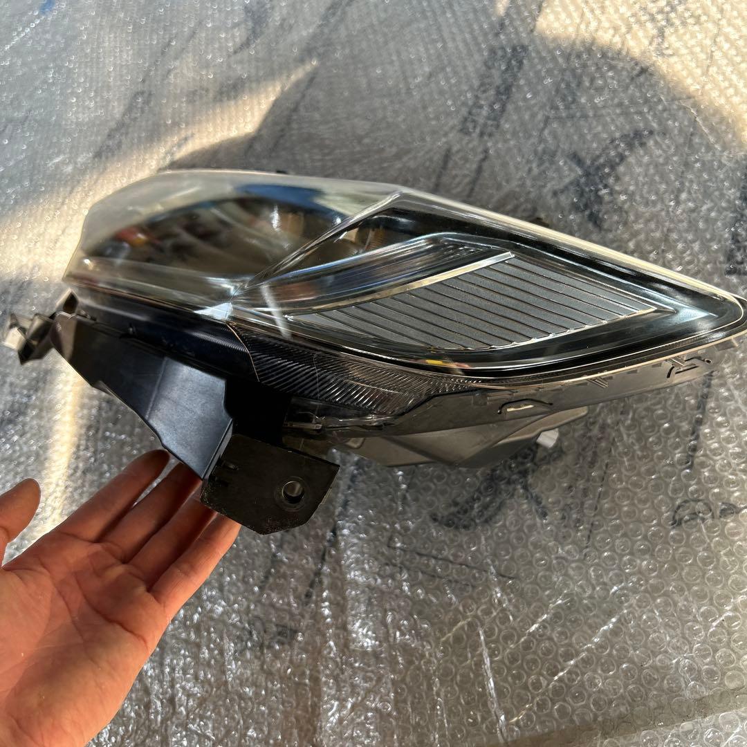 フィット　ヘッドライト　左　STANLEY W3674 ジャンク品