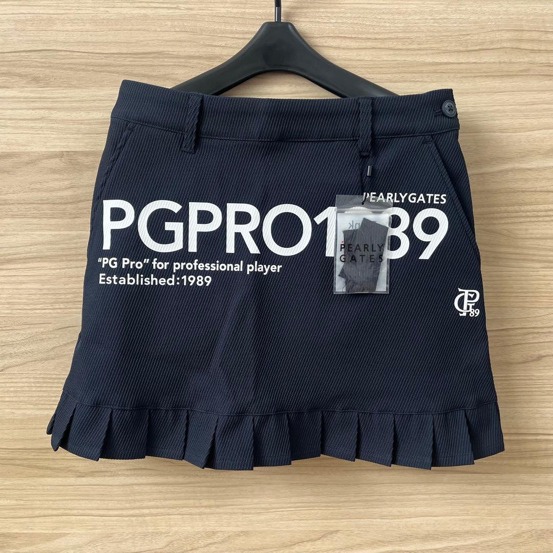 新品★28,600円 パーリーゲイツ 春夏ゴルフスカート 裾プリーツ 濃紺×白０