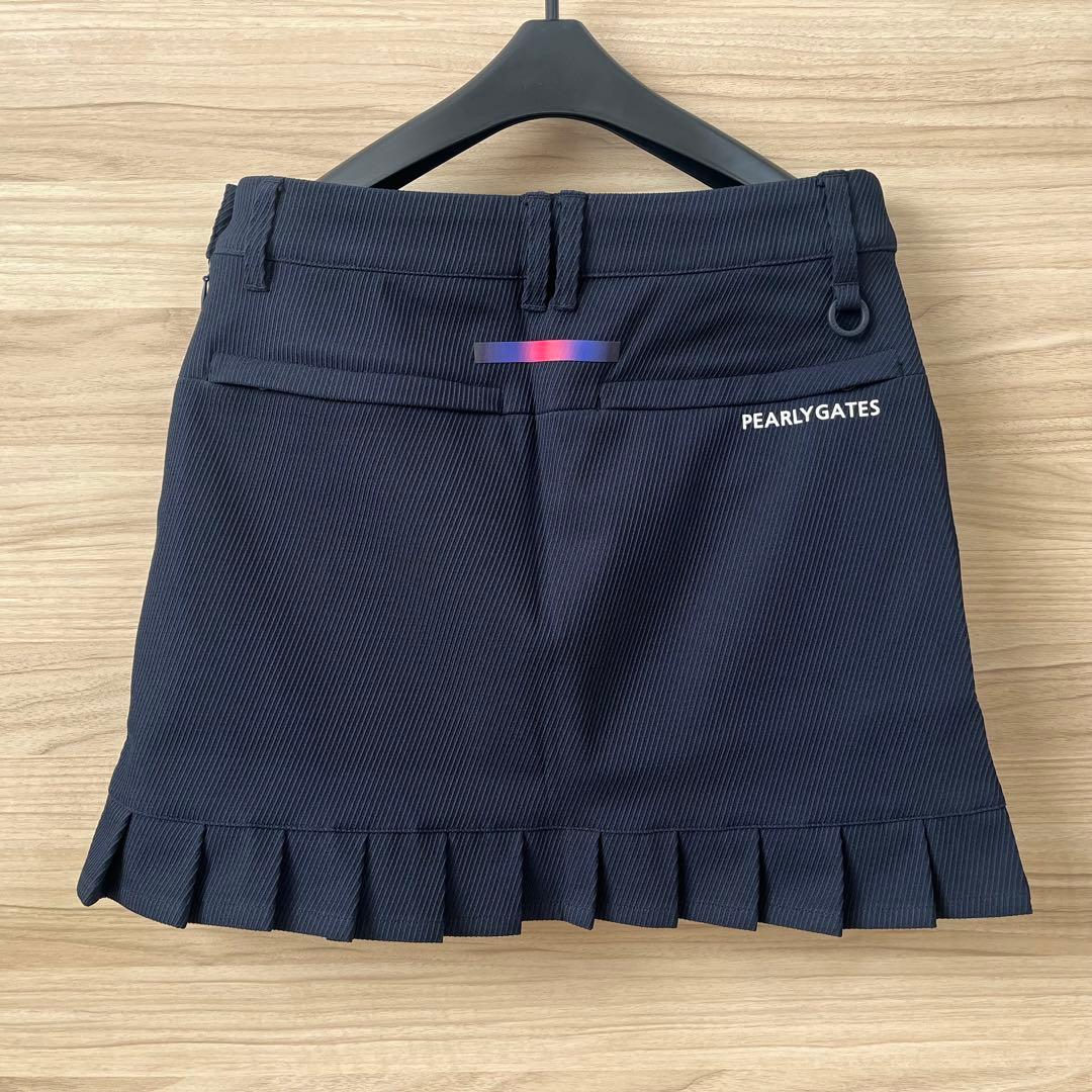 新品★28,600円 パーリーゲイツ 春夏ゴルフスカート 裾プリーツ 濃紺×白０