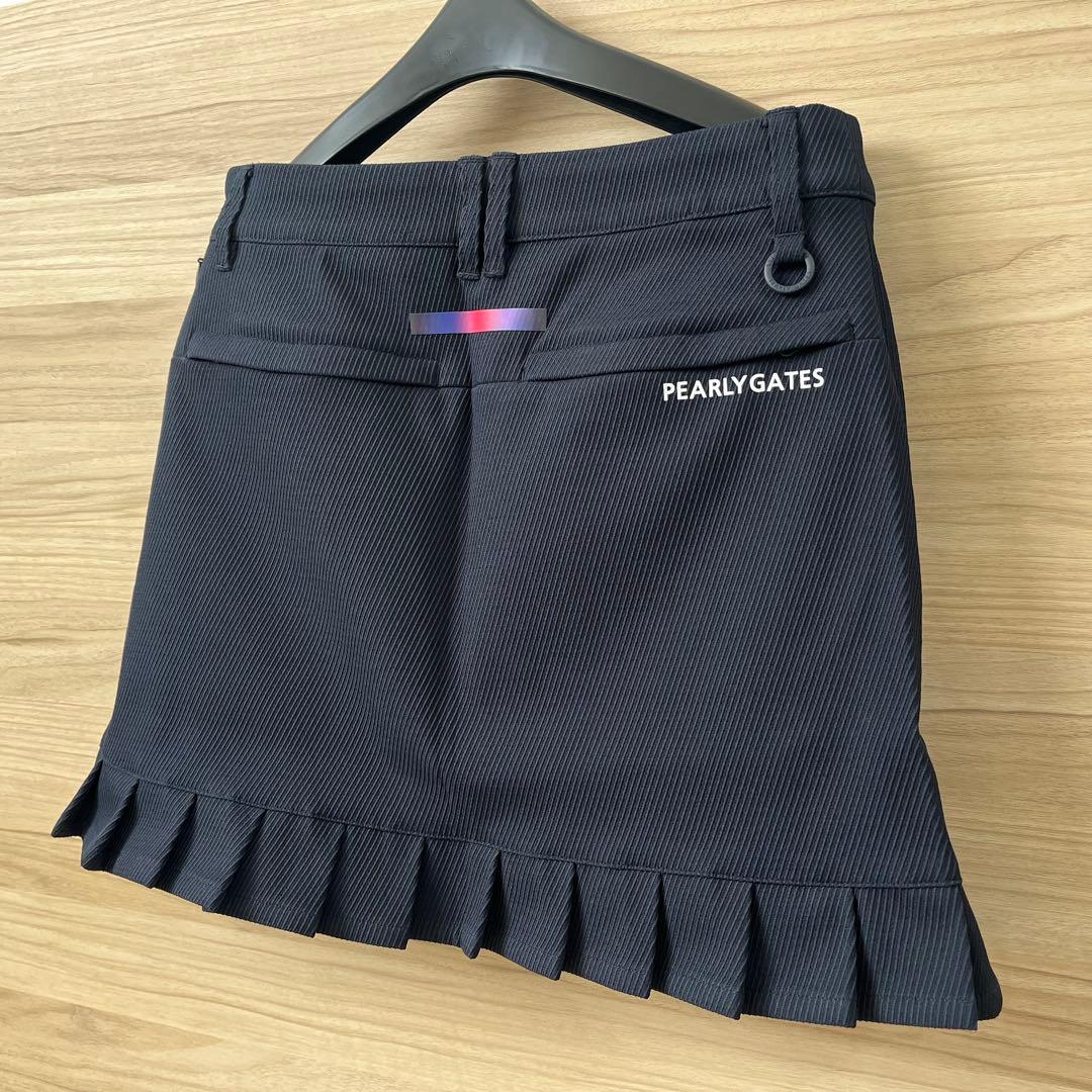 新品★28,600円 パーリーゲイツ 春夏ゴルフスカート 裾プリーツ 濃紺×白０