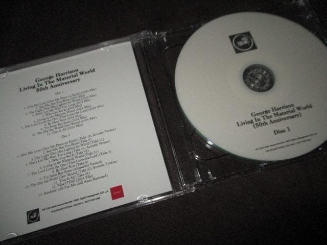 洋楽 e harrison living in the marerial .