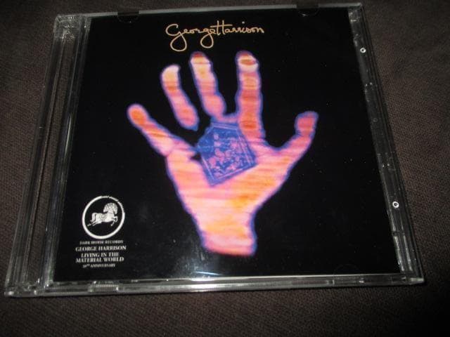 洋楽 e harrison living in the marerial .