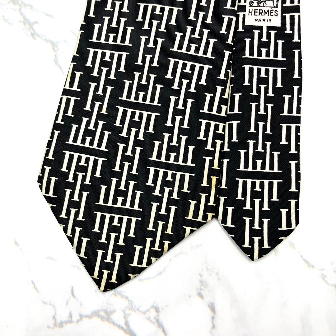 ◆良品◆HERMES エルメス ネクタイ 黒色 ロゴ柄 オシャレ 希少